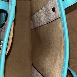 Turquoise and white bag and light gray MK on bag. Barely used, gorgeous bag.
